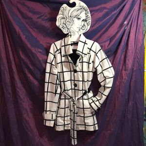 Hip length black & white window pane print jacket.